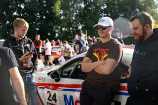 Corey Heim, driver of the #24 Nitro Motorsports Toyota GR86 Cup Car, stands by his car and greets fans during the annual parade of cars before Races 9 and 10 at Road America on August 17, 2023. -Photo by Zack Cramer
 | SRO Motorsports Group