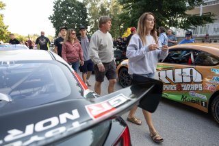 Fans mill about during the annual parade of cars before Races 9 and 10 at Road America on August 17, 2023., -Photo by Zack Cramer
 | SRO Motorsports Group
