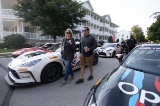 Fans mill about during the annual parade of cars before Races 9 and 10 at Road America on August 17, 2023. -Photo by Zack Cramer
 | SRO Motorsports Group