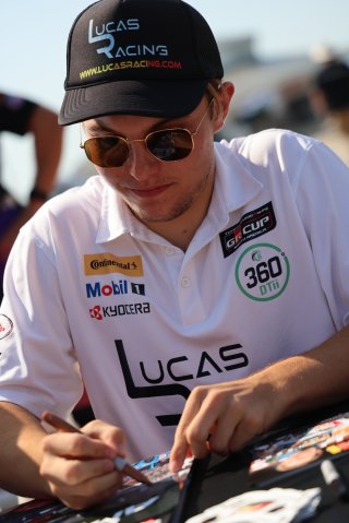 Lucas Weisenberg, driver of the #46 Lucas Racing Toyota GR86 Cup Car, during an autograph session before Race 10 at Road America on August 20, 2023. -Photo by Dave Biro
 | SRO Motorsports Group