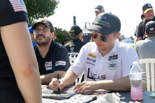 Lucas Weisenberg, driver of the #46 Lucas Racing Toyota GR86 Cup Car, signs autographs before Race 10 at Road America on August 20, 2023. -Photo by Zack Cramer
 | TGRNA               